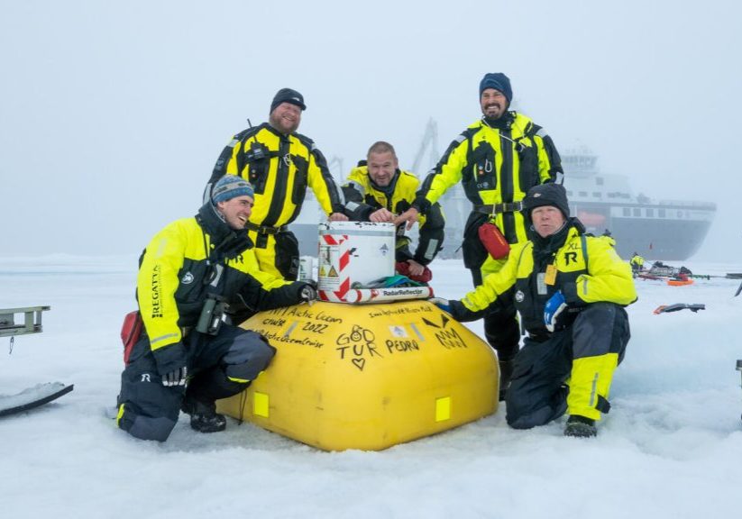 Happy deployment team after the buoy with an acoustic fish and zooplankton profiler was deployed near the North Pole